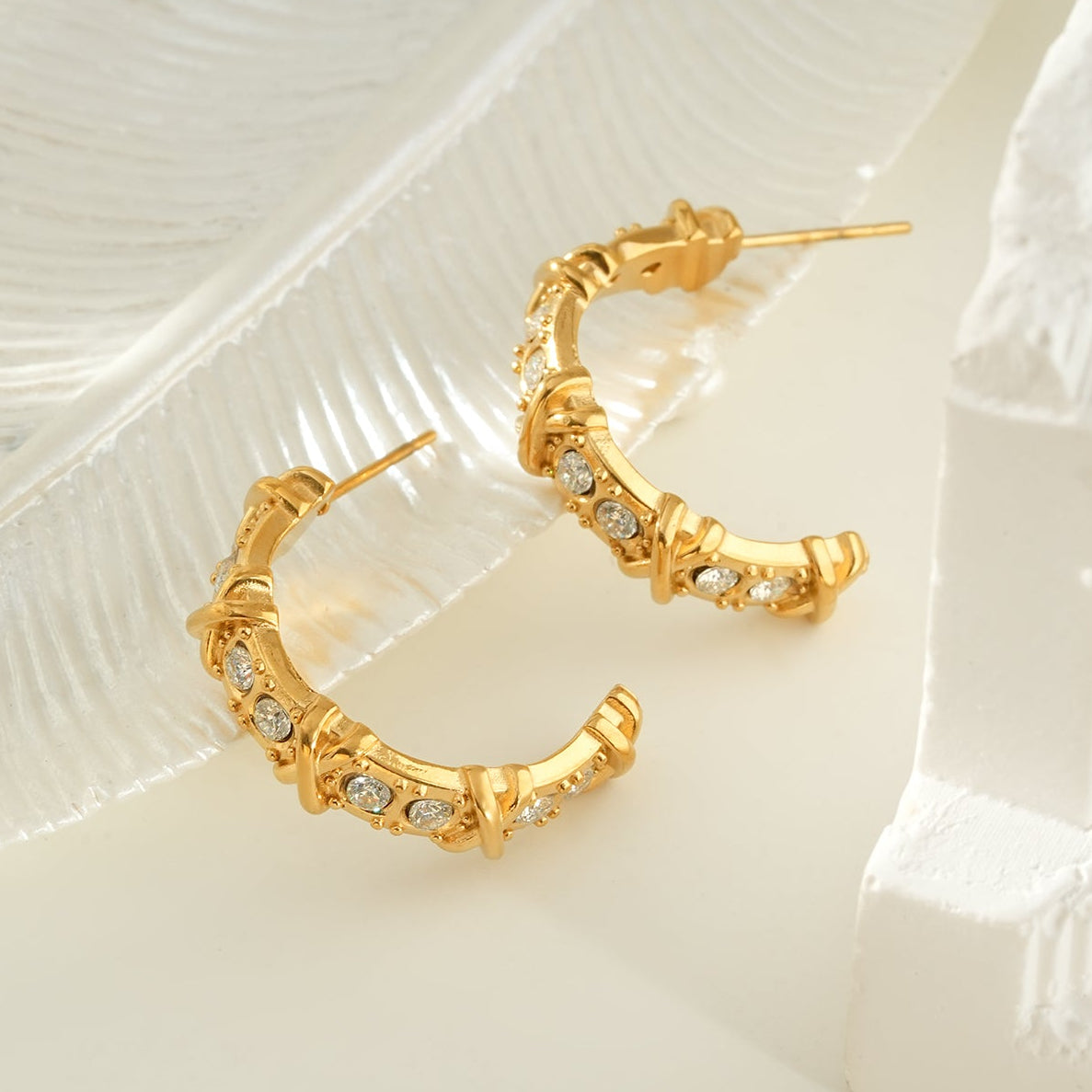 ELICA Gold: Zirconia Embedded Hoop Earrings with Ornate Detail & Crisscross Accents