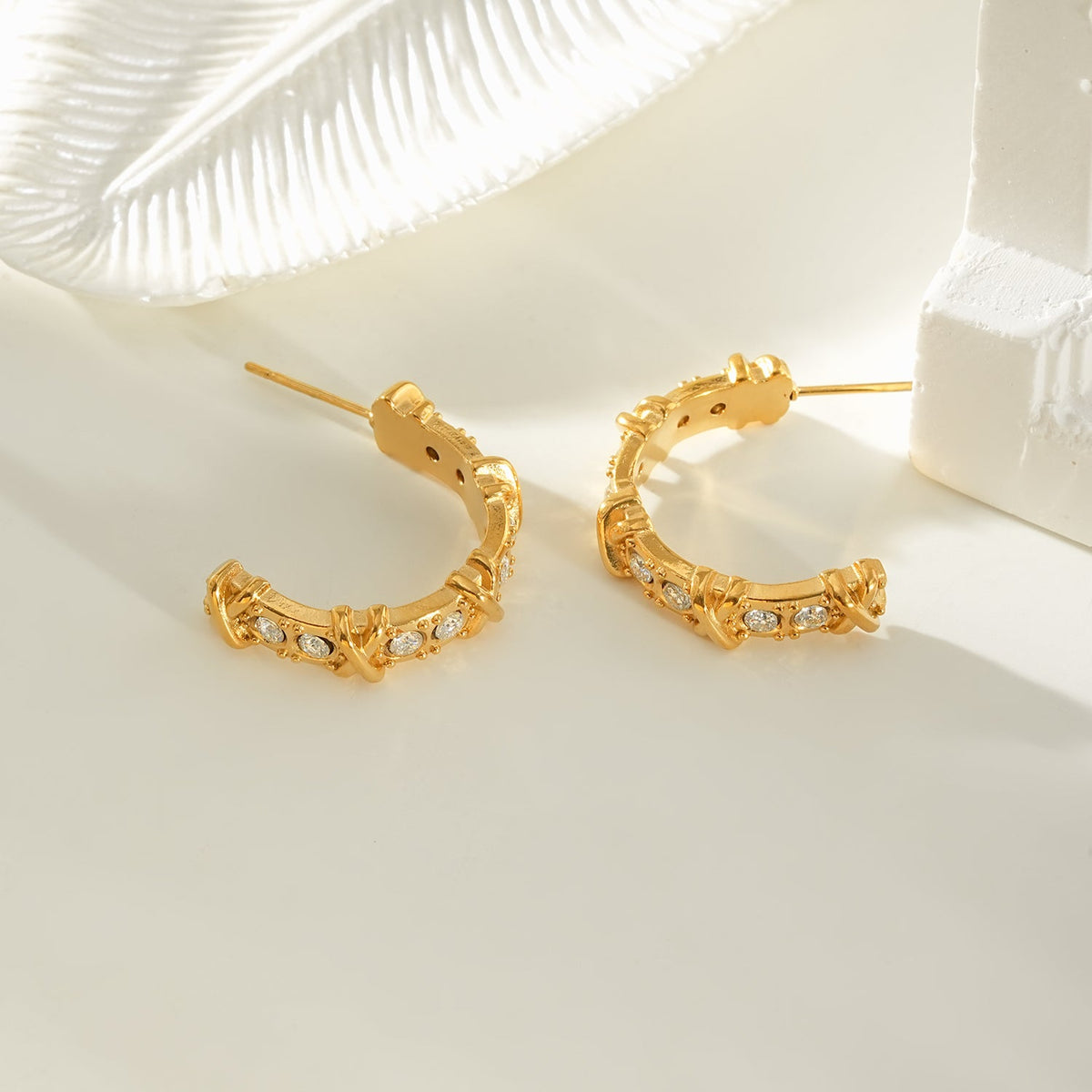 ELICA Gold: Zirconia Embedded Hoop Earrings with Ornate Detail & Crisscross Accents