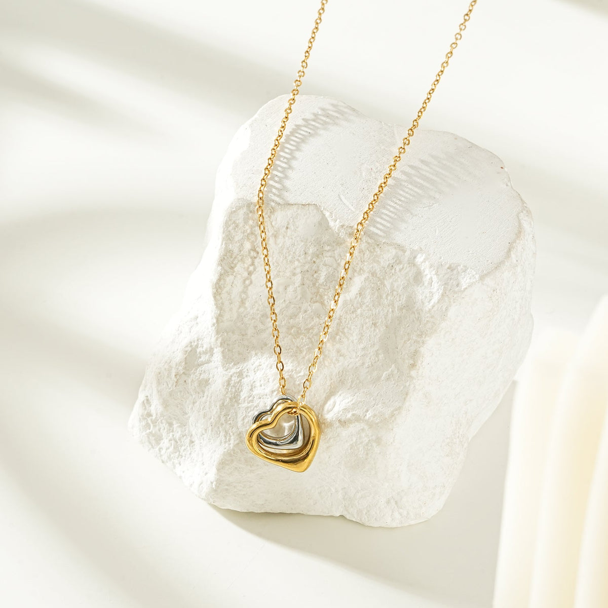 LOLANDA Gold+Silver: Dainty Gold Chain Necklace with Two Abstract Heart Charms in Gold & Silver