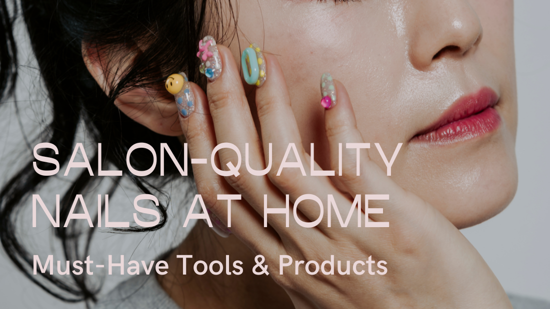 A close-up of colorful, artistic nails adorned with playful designs, showcasing a stylish hand against a minimalist background.